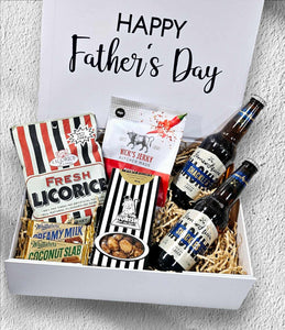 Father’s Day Box 3 featuring Fresh Liquorice, Nick’s Chilli Jerky, 2 James Squire Lagers, Morish Macadamias, and 2 Mini Whittaker’s Chocolates, all beautifully arranged in a gift box."