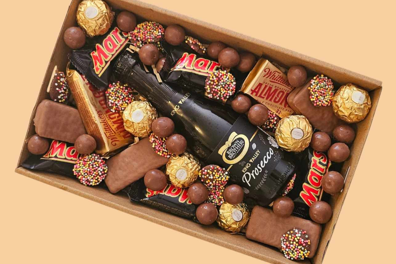 Confetti Box Co. Dessert Box featuring prosecco, Tim Tams, Ferrero Rocher, Maltesers, and Freckles – the perfect luxury gift box for celebrations in Perth