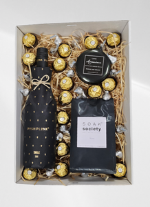 Posh Plonk Shiraz Gift Box: Perfect for relaxation, this luxurious set includes a 750ml bottle of Posh Plonk Shiraz, Soak Society Wellness Soak, an aromatic candle, Ferrero Rocher chocolates, and Hershey's Kisses. Finished with signature confetti, a beautiful bow, and a personalized message card for a thoughtful gift.