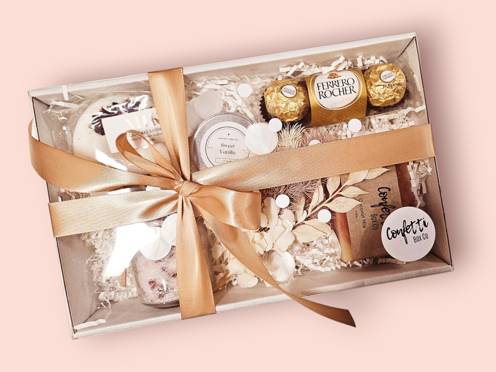 Soak and Relax Box 2: The ultimate relaxation gift featuring Lavender and Rose Bath Salts, a fun Donut Bath Bomb, Ferrero Rocher Chocolates, Coconut Milk Soap, Vanilla Lip Balm, and Dried Flowers. A perfect blend of soothing scents and indulgent treats for a serene experience.