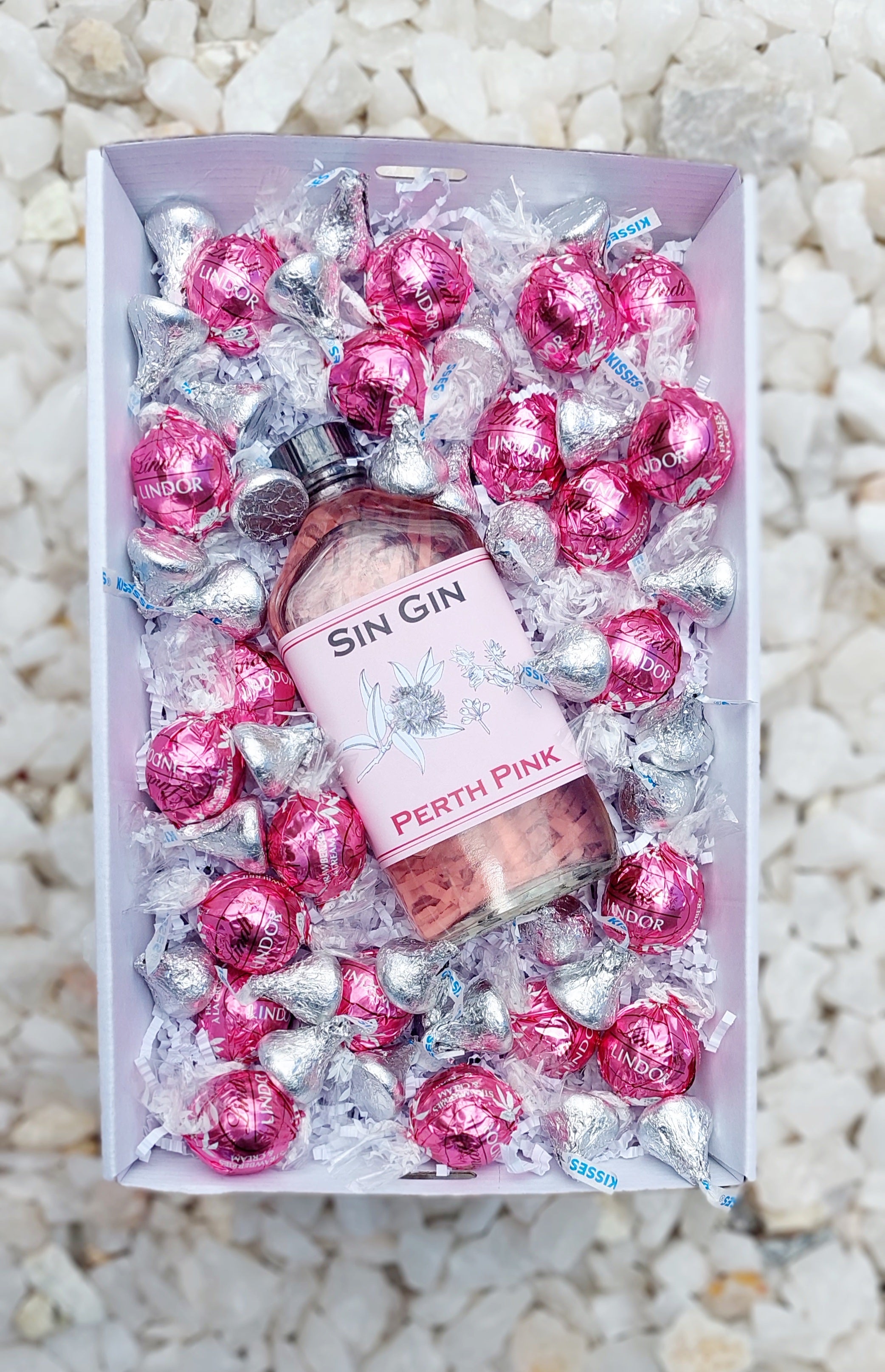 Chocolates & Spirits Gift Box: Celebrate someone special with the perfect pairing of 200ml Perth Pink Sin Gin Original Sin, 10 Lindt Chocolate Balls, and Hershey's Kisses. Includes a complimentary personalized message—just add your note at checkout for a thoughtful touch.