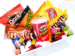 Chippy's Box: The ultimate snack pack to share with your BFF or significant other. Perfect for a movie night, featuring chips, chocolates, M&Ms, Pringles, Chupa Chups, and a sweet lolly mix. Includes mini snacks, personalized messages, and two size options: Medium (double) and Large (triple). A fun, delicious gift for any occasion!