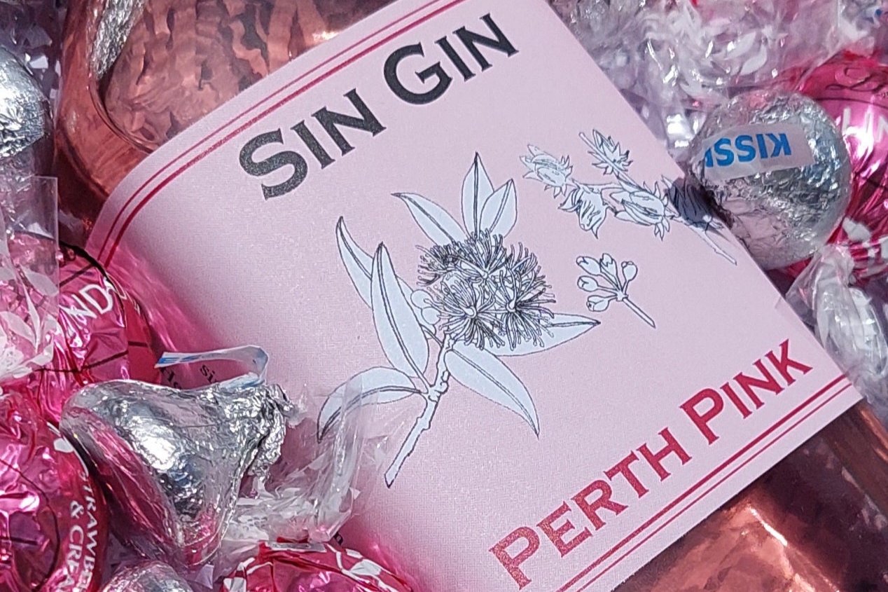 Chocolates & Spirits Gift Box: Celebrate someone special with the perfect pairing of 200ml Perth Pink Sin Gin Original Sin, 10 Lindt Chocolate Balls, and Hershey's Kisses. Includes a complimentary personalized message—just add your note at checkout for a thoughtful touch.