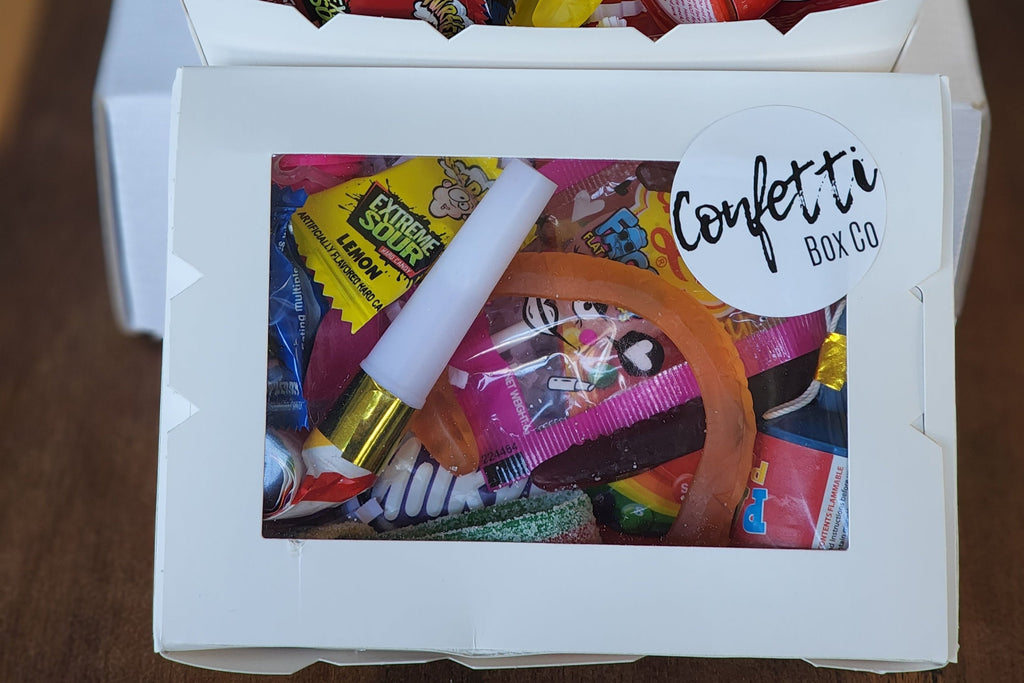Party Box: The ultimate party treat! Filled with fun surprises like a party popper, whistle, mini bubbles, Skittles, Mini Milky Way bar, Chupa Chups Faces lollipop, mini Chupa Chups, Warheads, and mixed lollies. Perfect for adding excitement and sweetness to any celebration