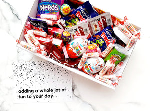 Ultimate Sugar Rush Treat Box: Packed with indulgent lollies, Nutella, and chocolate, this box includes a mini Nutella jar, Chupa Chups Sours, Kinder Eggs, Skittles, Nutella scoops, Wizz Fizz, Nerds, Mega Warheads, mini chocolate bars, and a variety of assorted lollies and chocolates for the perfect sweet indulgence.